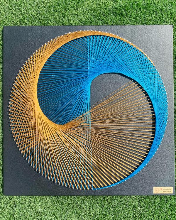 This string art mandala with its black leather base on a wooden b... — islamic string art handmade by Woody Strings Lahore Pa