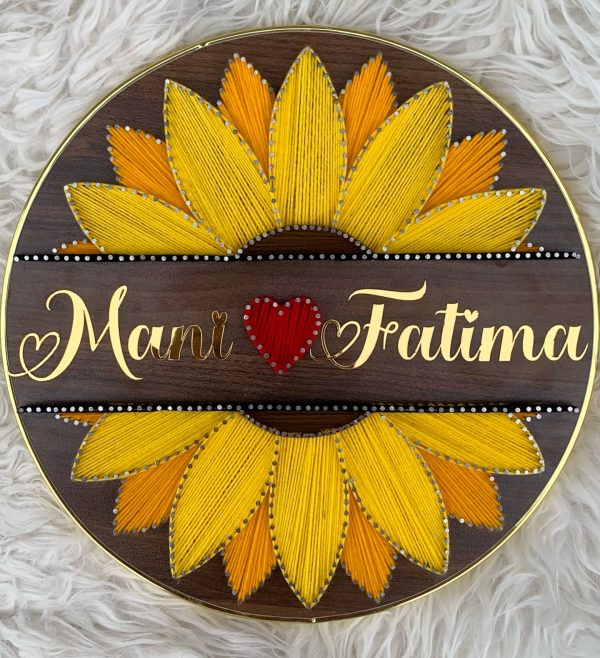 A timeless sunflower frame with golden acrylic names — custom name string art handmade by Woody Strings Lahore Pakistan