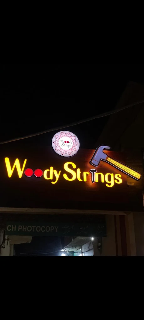 Our workshop sign — nails, hammer & string